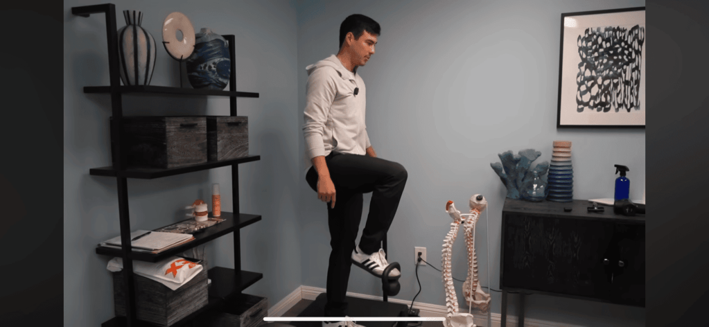 Tyler Bigenho chiropractor balancing on one leg