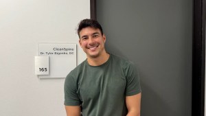 Dr. Tyler Bigenho at the CleanSpine entrance in Irvine, CA, serving the Orange County community