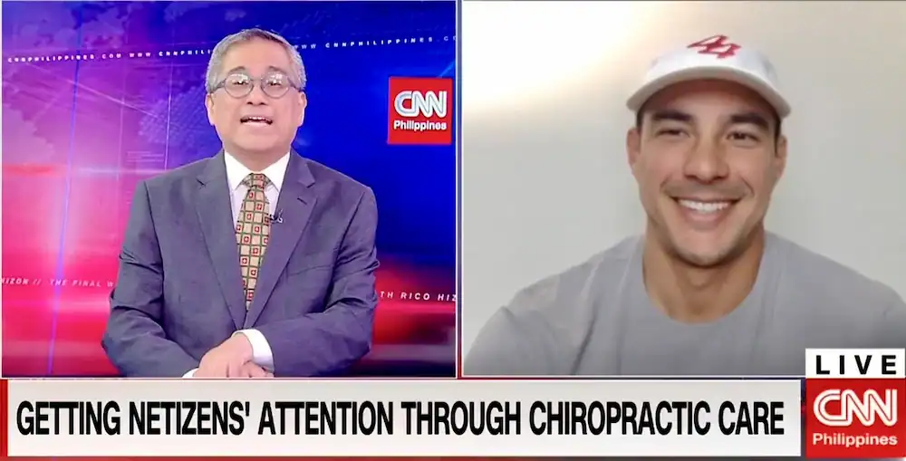 Dr. Tyler Bigenho, a reputable chiropractor in Irvine, discussing spinal health on CNN Philippines with Rico Hizon.